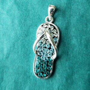 2/10$ JCM blue crystals and silver tone sandal charm pendant